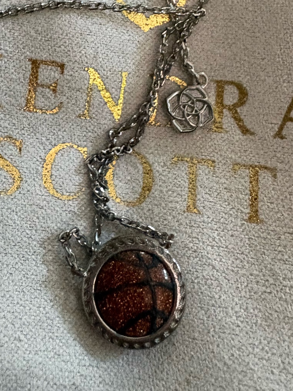 Kendra Scott Silver and Brown Glitter Basketball Pendant Necklace